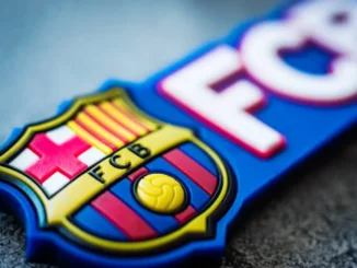 Logo of Football Club Barcelona close-up. Emblem of FC Barcelona on souvenir or magnet. Fan accessories / Bigstock.com/LGreen